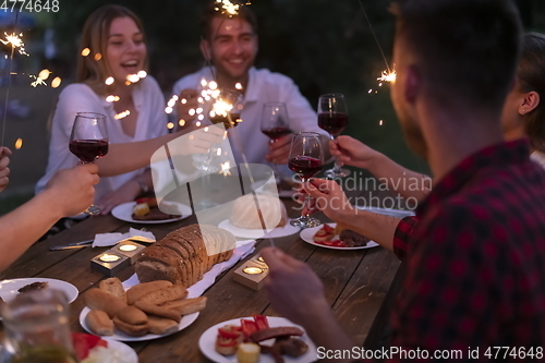 Image of french dinner party on summer