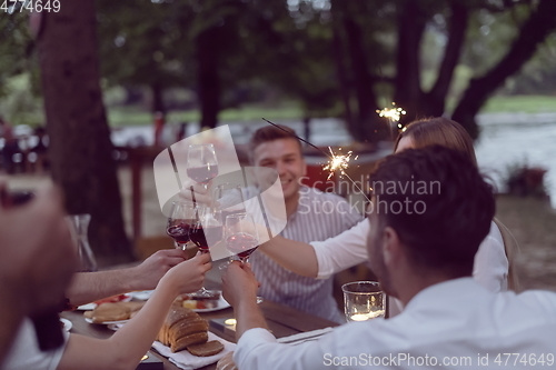 Image of french dinner party on summer