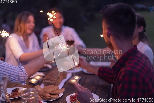 Image of french dinner party on summer