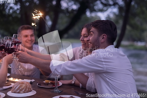 Image of french dinner party on summer