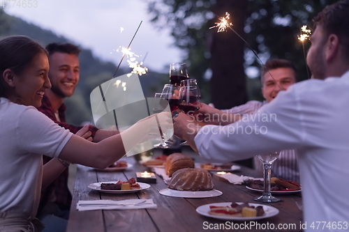 Image of french dinner party on summer