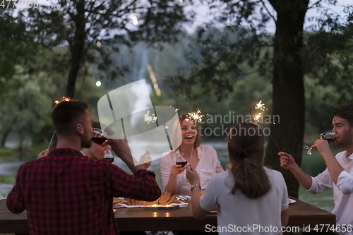 Image of french dinner party on summer