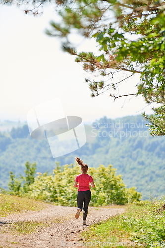 Image of woman enjoying in a healthy lifestyle while jogging