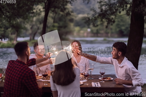 Image of french dinner party on summer