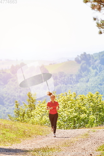 Image of woman enjoying in a healthy lifestyle while jogging