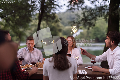 Image of french dinner party on summer