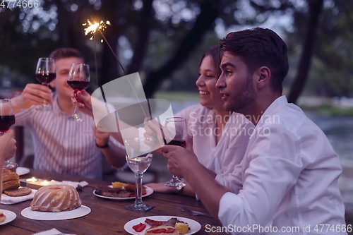 Image of french dinner party on summer