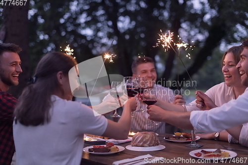 Image of french dinner party on summer