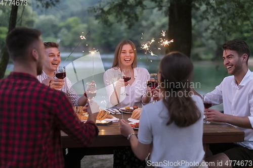 Image of french dinner party on summer