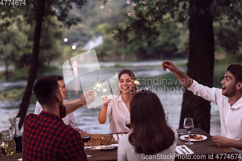 Image of french dinner party on summer