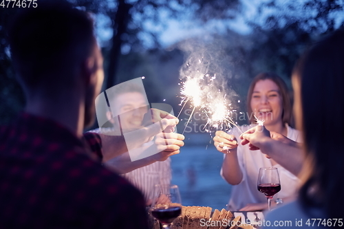 Image of french dinner party on summer