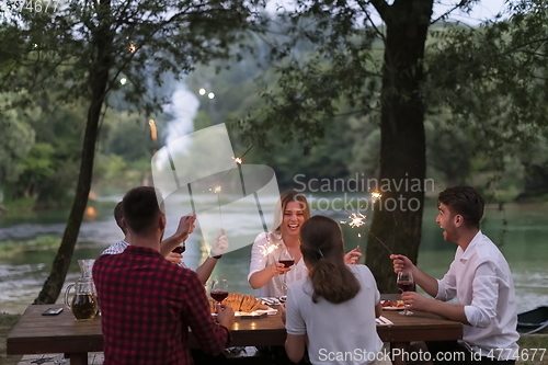 Image of french dinner party on summer