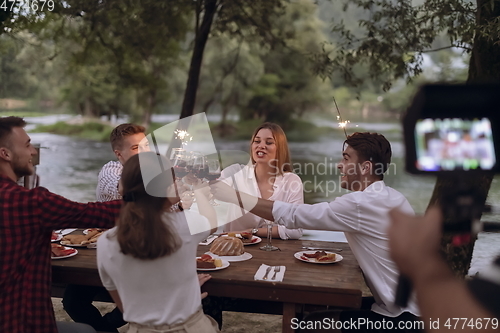 Image of french dinner party on summer