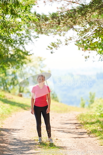 Image of woman enjoying in a healthy lifestyle while jogging