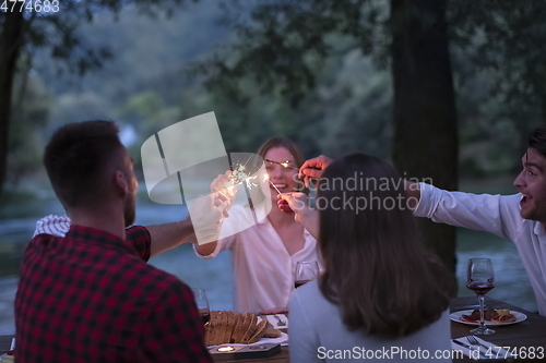 Image of french dinner party on summer