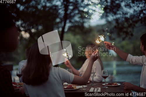 Image of french dinner party on summer