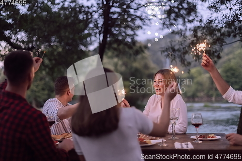 Image of french dinner party on summer