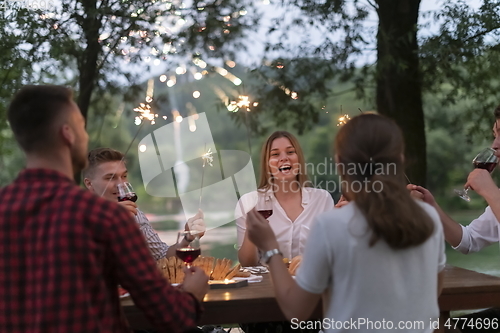 Image of french dinner party on summer