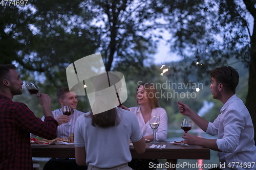 Image of french dinner party on summer