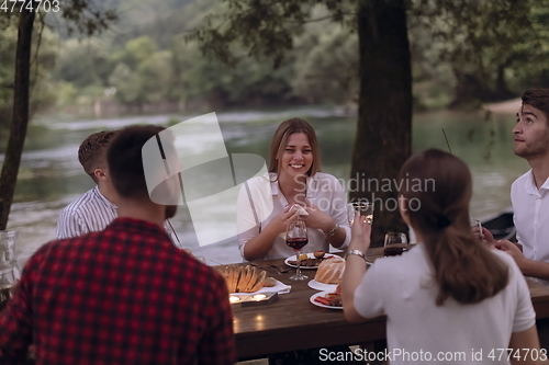 Image of french dinner party on summer