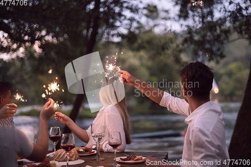 Image of french dinner party on summer