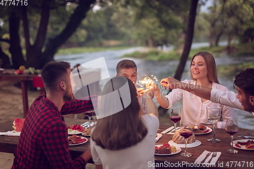 Image of french dinner party on summer