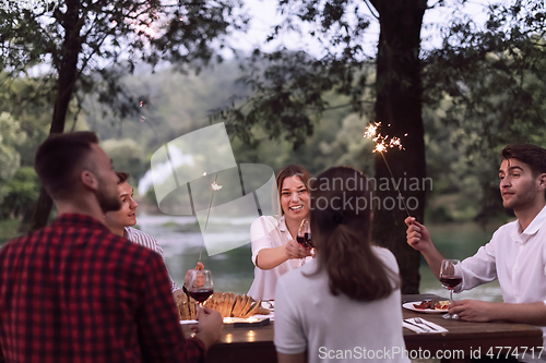 Image of french dinner party on summer