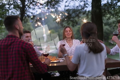 Image of french dinner party on summer