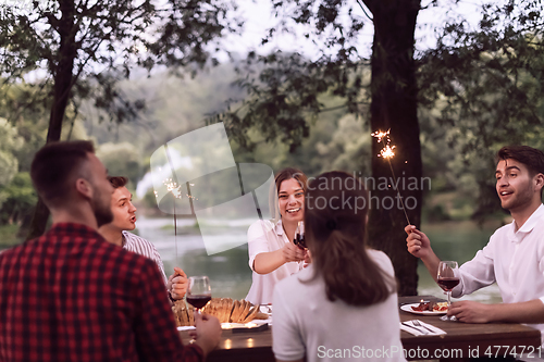 Image of french dinner party on summer