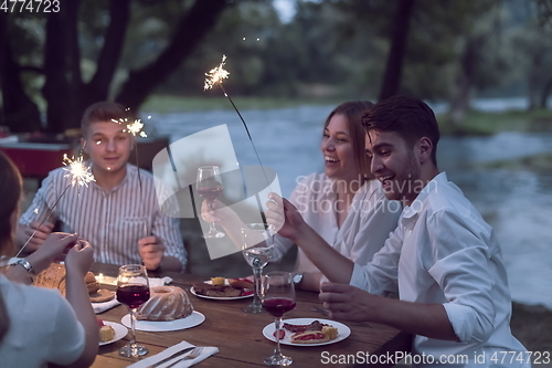 Image of french dinner party on summer