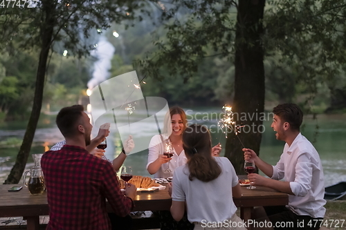 Image of french dinner party on summer