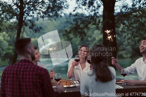 Image of french dinner party on summer