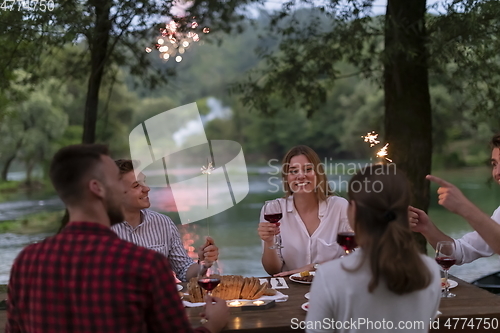 Image of french dinner party on summer