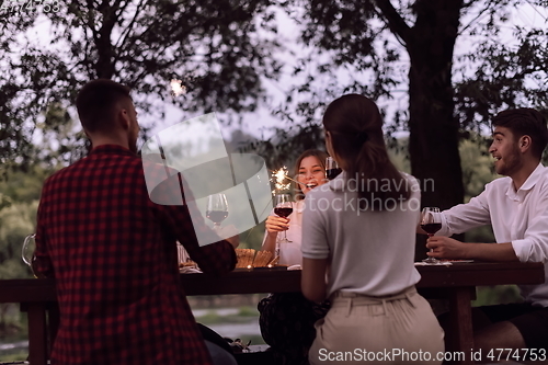 Image of french dinner party on summer