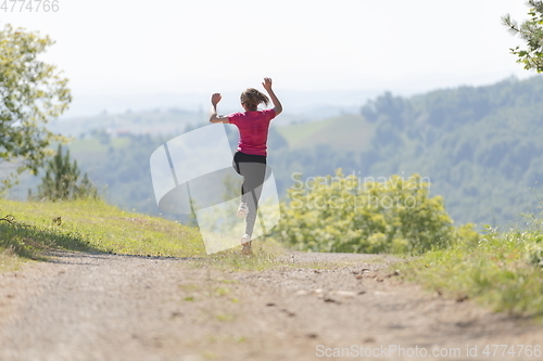 Image of woman enjoying in a healthy lifestyle while jogging