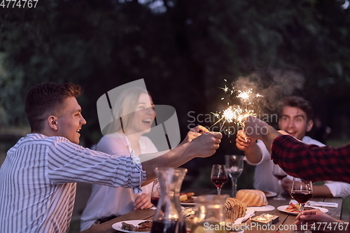 Image of french dinner party on summer
