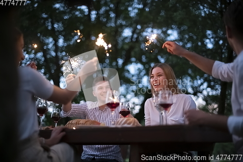 Image of french dinner party on summer