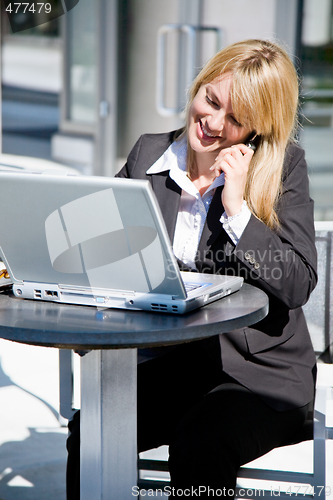 Image of Caucasian businesswoman on the phone
