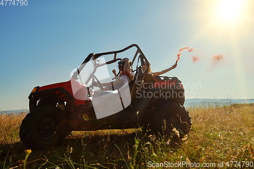 Image of  colorful torches while driving a off road buggy car