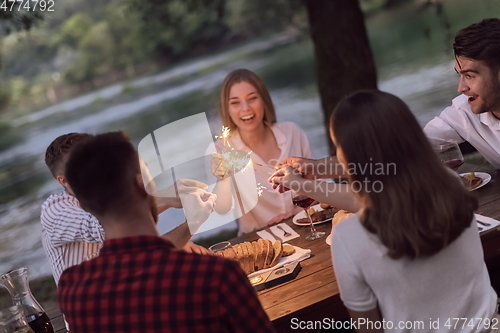 Image of french dinner party on summer