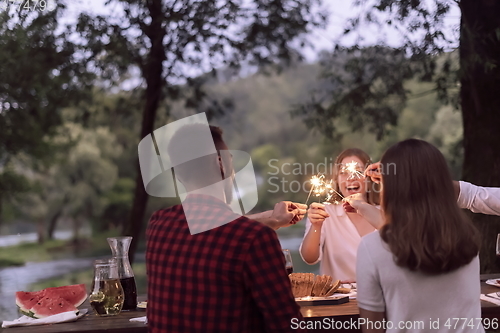 Image of french dinner party on summer