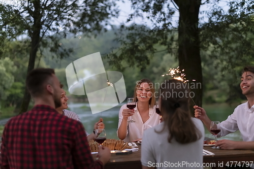 Image of french dinner party on summer