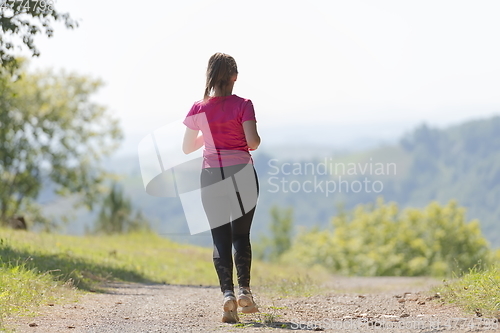 Image of woman enjoying in a healthy lifestyle while jogging