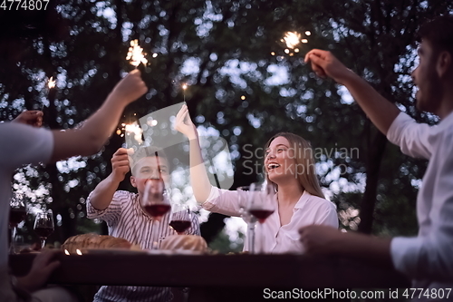 Image of french dinner party on summer