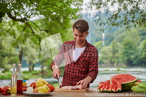 Image of man cooking tasty food for french dinner party