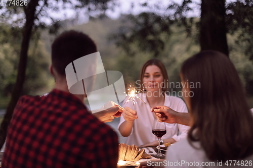 Image of french dinner party on summer