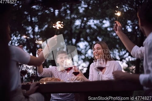 Image of french dinner party on summer