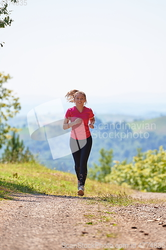 Image of woman enjoying in a healthy lifestyle while jogging