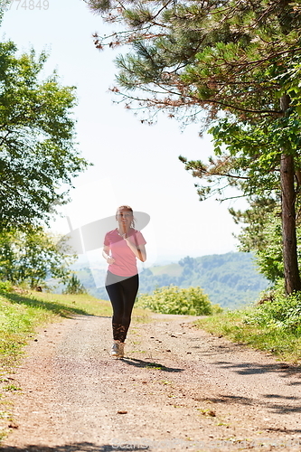 Image of woman enjoying in a healthy lifestyle while jogging