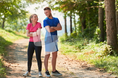 Image of young couple preparing for a morning run